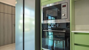 A kitchen with a stainless steel refrigerator, a built-in oven, and a microwave. - 3BR PoolVilla 7 Mins to Nai Harn V108 (Rawai)