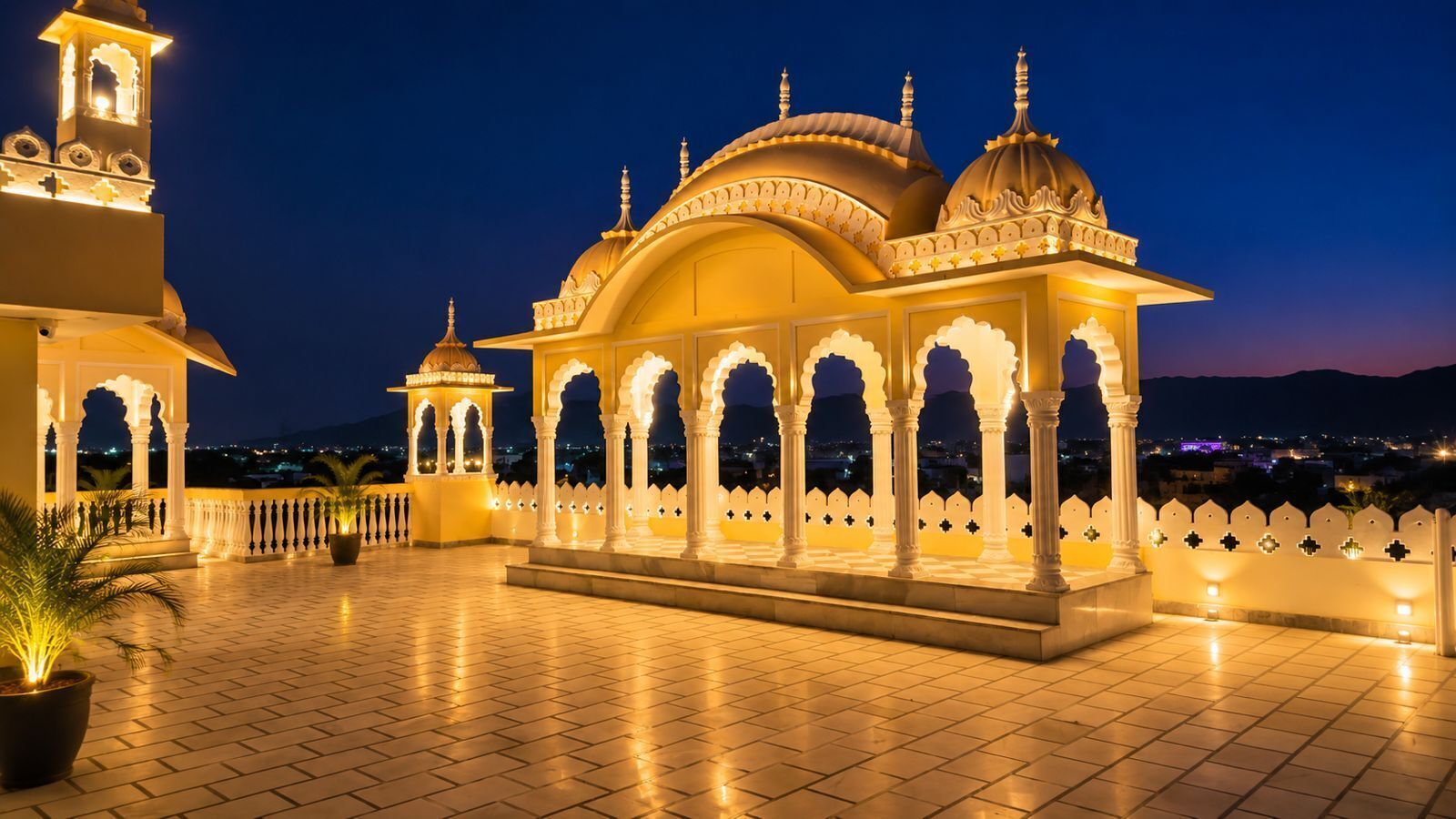 A traditional building with domed structures and arches, a clock tower, and a tiled terrace.