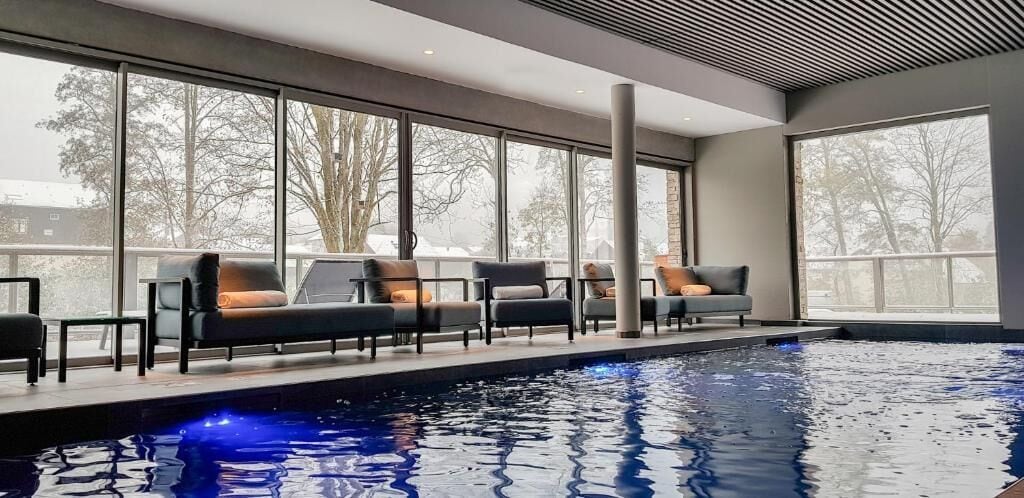 Indoor pool, open 8:00 AM to 11:00 AM, pool loungers