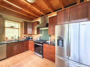Fridge, stovetop, dishwasher, coffee/tea maker
