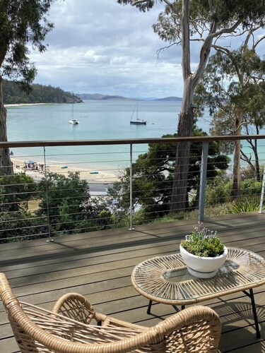 Beach house with sauna. Stunning views, cosy renovated mid-century gem