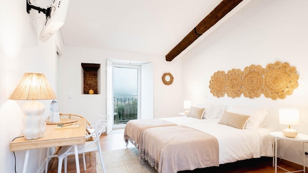 A bedroom with a bed, bedside tables, a desk, and a chair. - Room '2' with Shared Pool (Fortios)