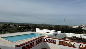 A rooftop pool with a view of the surrounding landscape. - Room '2' with Shared Pool (Fortios)