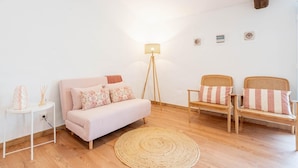 A modern living room with a sofa, two chairs, a floor lamp, and a woven rug. - 'Room 3' with Shared Pool (Fortios)