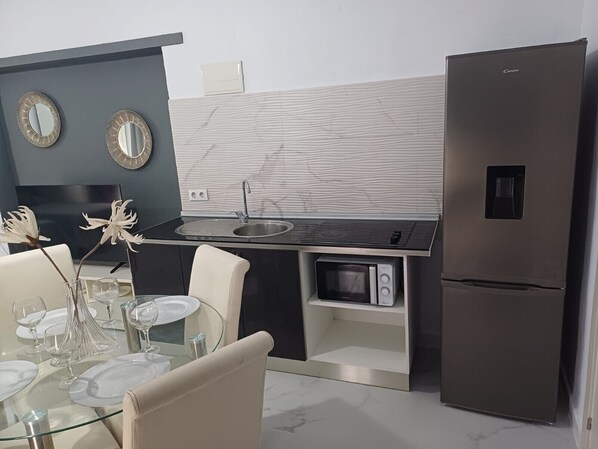 Fridge, microwave, stovetop, coffee/tea maker
