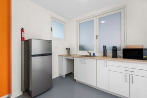 Fridge, microwave, stovetop, coffee/tea maker