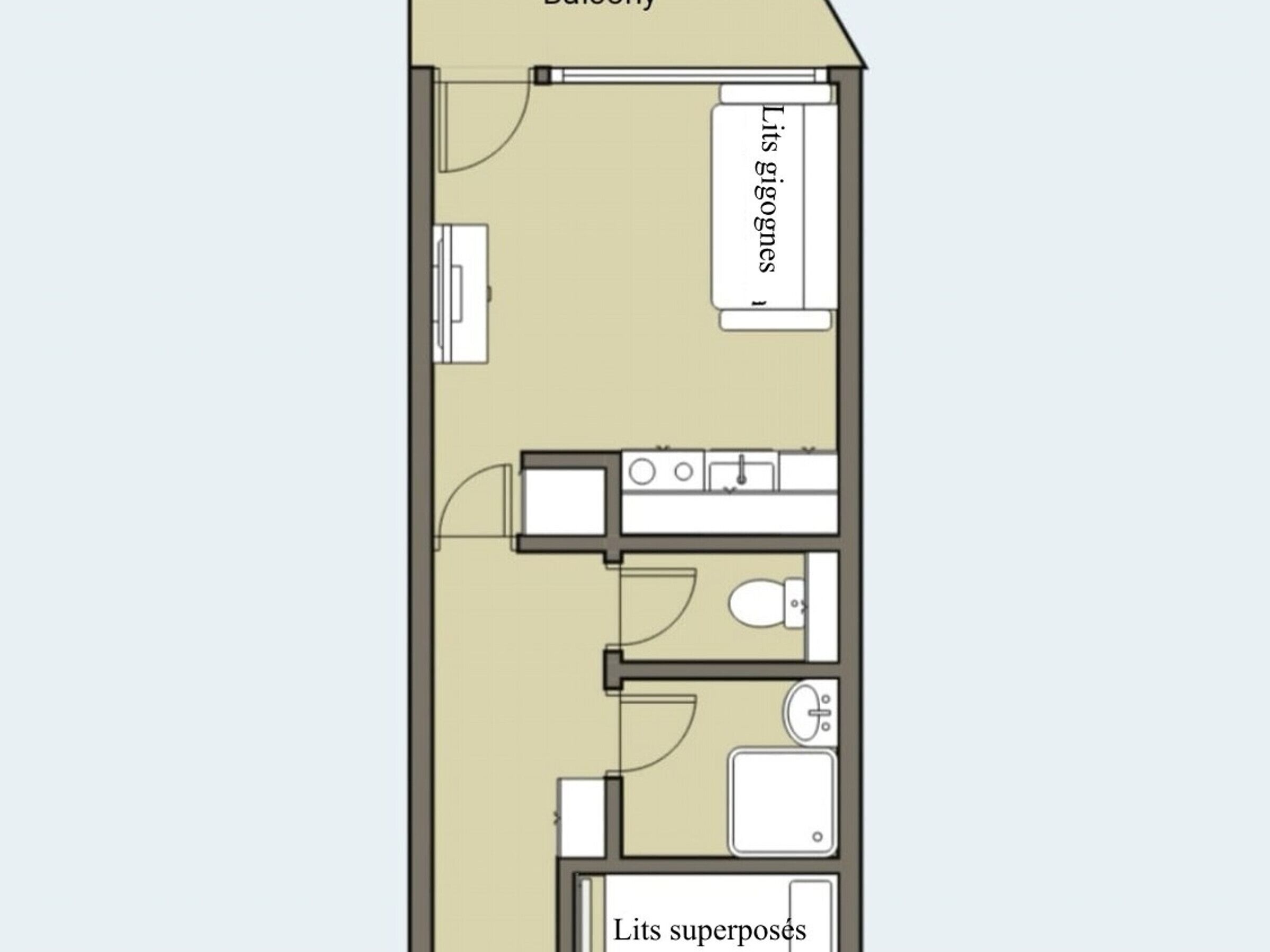 Un plan d’étage d’une chambre d’hôtel comprenant une salle de bain, un coin cuisine et un petit espace salon.