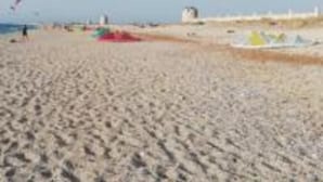 A sandy beach with tents and a clear sky. - Limonero New City Apartment 1 With Private Parking (Lefkada)