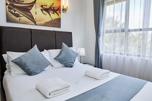 Down comforters, memory foam beds, blackout drapes, iron/ironing board - Sangara by Edmor Suites. (Nairobi)