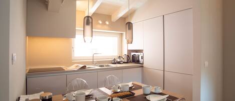 Fridge, microwave, stovetop, coffee/tea maker