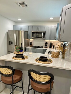 Fridge, microwave, stovetop, coffee/tea maker