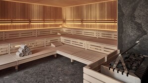 A sauna with wooden benches and a stone wall. - The View (St. Moritz)
