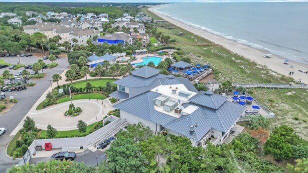 A coastal residential area with a large house featuring a swimming pool, a beach, and a view of the ocean. - Oceans Rest Private Pool, luxury living in DeBordieu 7 bedrooms (Georgetown)