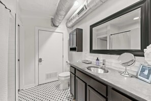 Shower, hair dryer, towels, shampoo