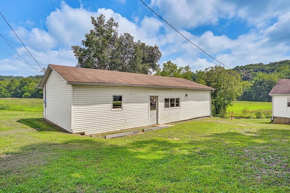 A single-story white building with a brown roof, a small porch, and a door. - 4 Mi to Ohio River: Quiet Guest House w/ Yard! (Belpre)
