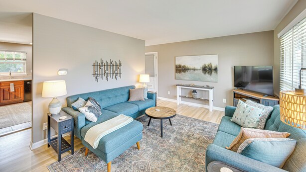 A living room with a sofa, a coffee table, and a TV. - Near Dtwn Harrisburg: Stylish Home w/ Patio & Yard (Camp Hill)