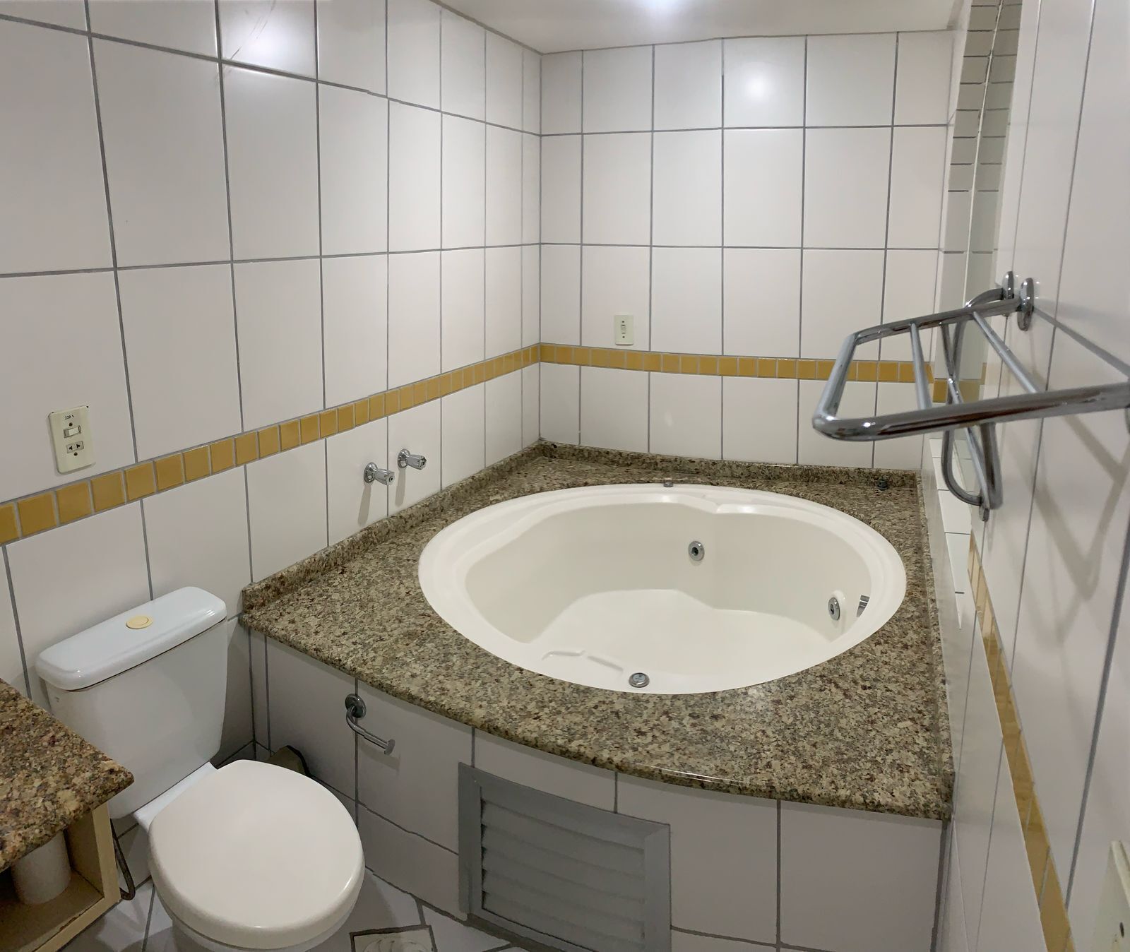 Jetted bath, hair dryer, towels, toilet paper