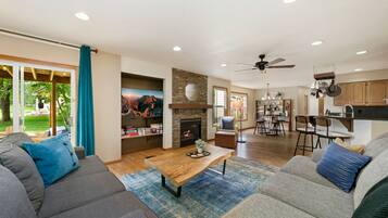 House, Multiple Beds, Patio, Garden View (2765 27th CT SW) | Living area | 55-inch flat-screen TV with digital channels, fireplace