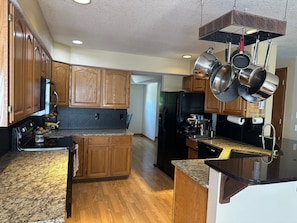 House, Multiple Beds, Patio, Garden View (2765 27th CT SW) | Private kitchen | Fridge, microwave, oven, stovetop