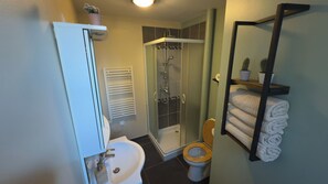 Shower, free toiletries, hair dryer, slippers