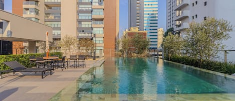 Outdoor pool, open 7:00 AM to 10:00 PM, pool umbrellas, pool loungers