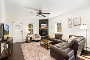 House, Multiple Beds, Patio, Garden View (205 Locust Street) | Living area | 55-inch flat-screen TV with digital channels, fireplace - Windsor Farmhouse Family Fun, Yard & Fireplace (Windsor)