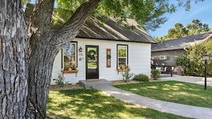 A single-story house with a front porch, a mailbox, and a number 205 sign. - Windsor Farmhouse Family Fun, Yard & Fireplace (Windsor)