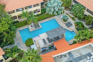 Outdoor pool, open 8:00 AM to 8:00 PM, pool umbrellas