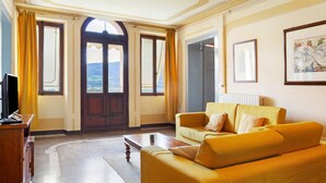 A room with a sofa, a coffee table, a television, and a large window with curtains. - Apartment 'Bivai - Merlot' with Shared Pool, Private Terrace and Wi-Fi (Bivai)