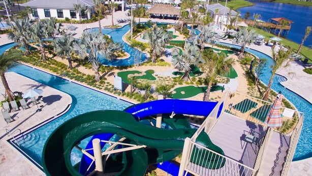 A resort with a large water park, including a water slide and multiple pools. - 5BR Storey Lake Home, Heated Pool (Kissimmee)