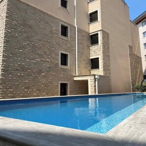 Apartment, 1 Bedroom, Smoking, Balcony | Pool | Outdoor pool