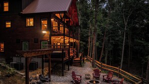A log cabin with a deck, outdoor seating, and a fire pit. - NEW Luxury Cabin w/ Views*Private Pool*Game Room*Hot Tub (SEVIERVILLE)