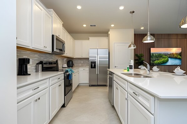 Fridge, microwave, oven, stovetop - Luxury 5BR Villa w/ Pool – Windsor Cay Resort (Clermont)