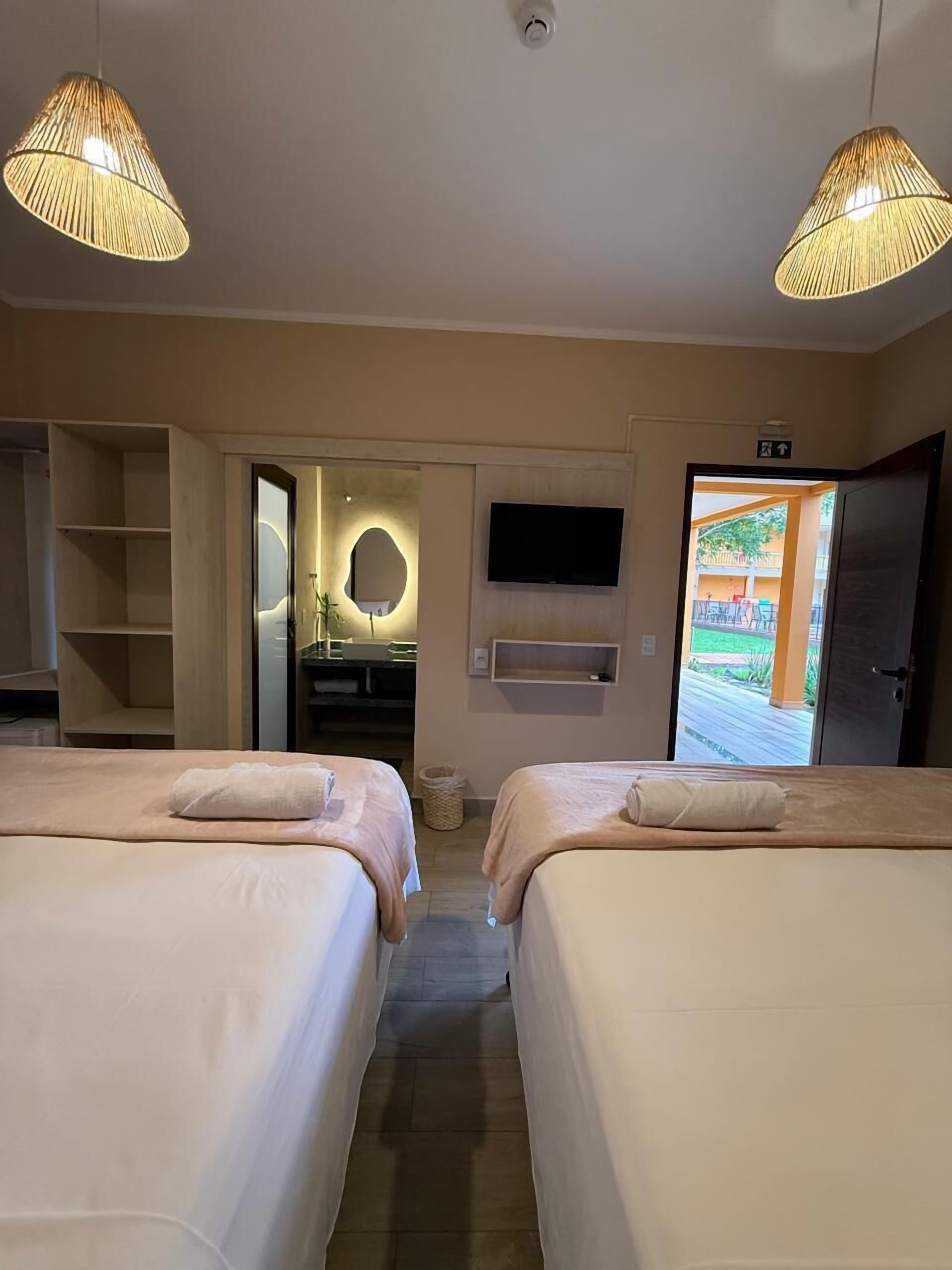 Quarto luxo, vista para o jardim