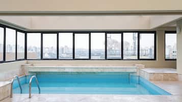 Outdoor pool, open 6:00 AM to 10:00 PM, pool umbrellas, pool loungers