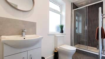 Shower, hair dryer, towels