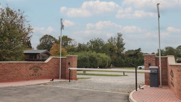 A brick entrance gate to a park with a sign reading "The Meadows Holiday Park". - Meadows Park 3 (Hull)