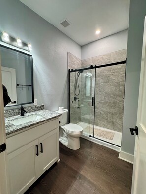 Shower, hair dryer, towels, soap