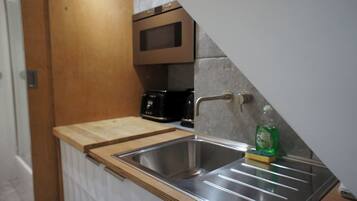 Fridge, microwave, toaster, cookware/dishes/utensils