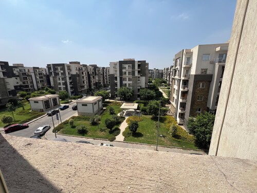 An Energetic green garden view3-BR apartment in enjoyable Cairo with full AC