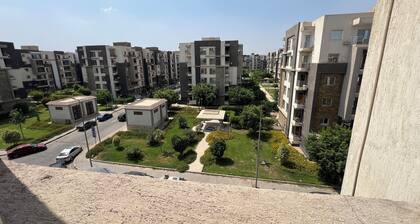 An Energetic green garden view3-BR apartment in enjoyable Cairo with full AC