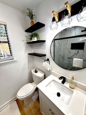 Shower, hair dryer, towels, soap