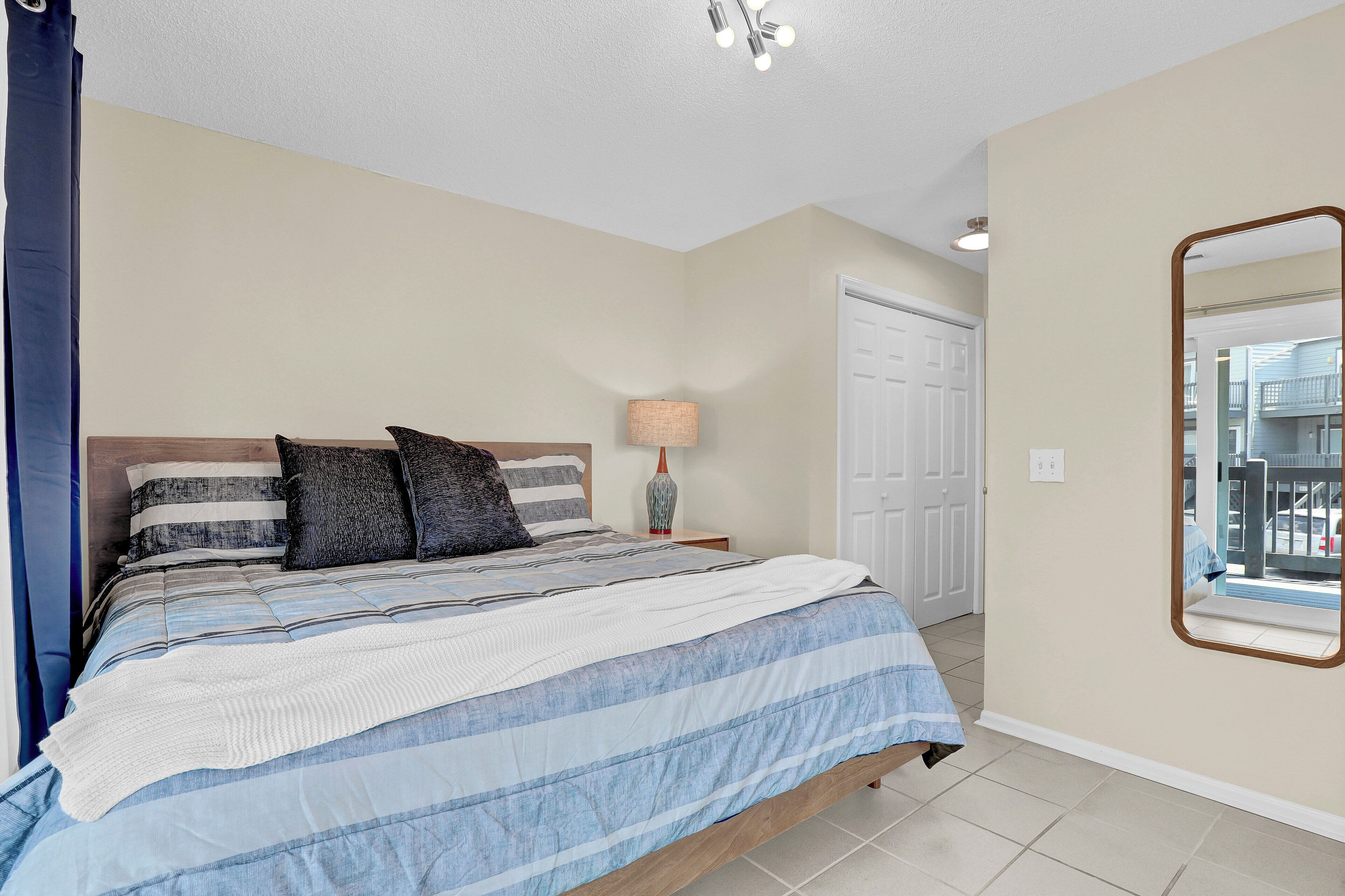 King bed, plenty of room and abundant light fill the master bedroom with bath!