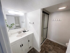 Shower, hair dryer, towels, soap