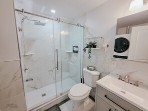 Shower, hair dryer, towels, soap