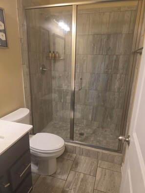 Shower, towels, soap, toilet paper