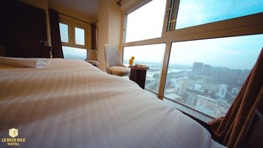 Habitació doble Deluxe, vistes a la ciutat | Caixa forta a l'habitació, habitacions insonoritzades i wifi gratuïta 