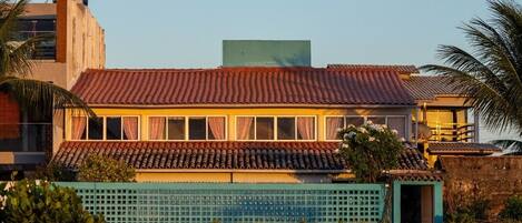 A building with a tiled roof and multiple windows.