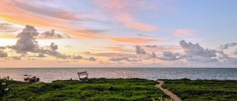 On the beach, white sand, sun-loungers, beach umbrellas