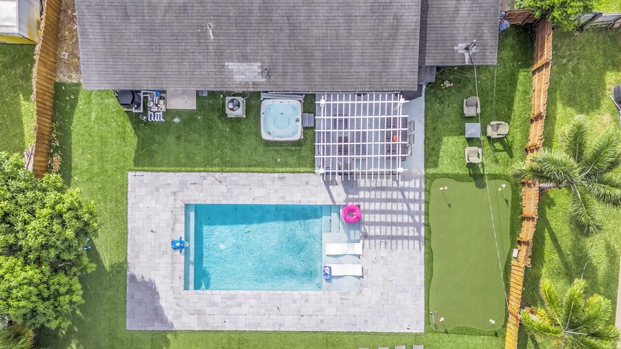 Pool, Hot Tub & Putting Green Near Deerfield Beach Oasis on Fourth by Avantstay